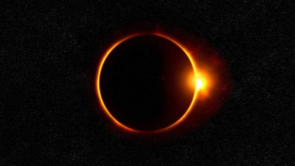dark night sky with the moon passing in front of the sun (eclipse)